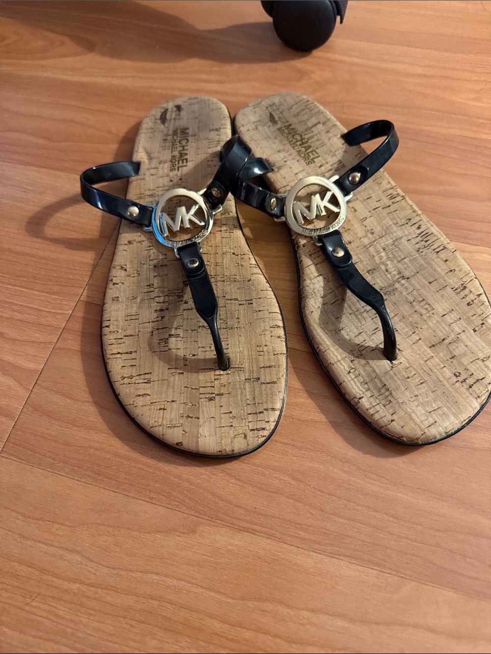 Michael Kors Black Thong Sandals with Gold MK Medallion